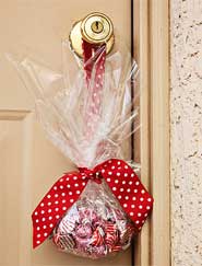 Give a neighbor a bag full of Hershey's kisses.